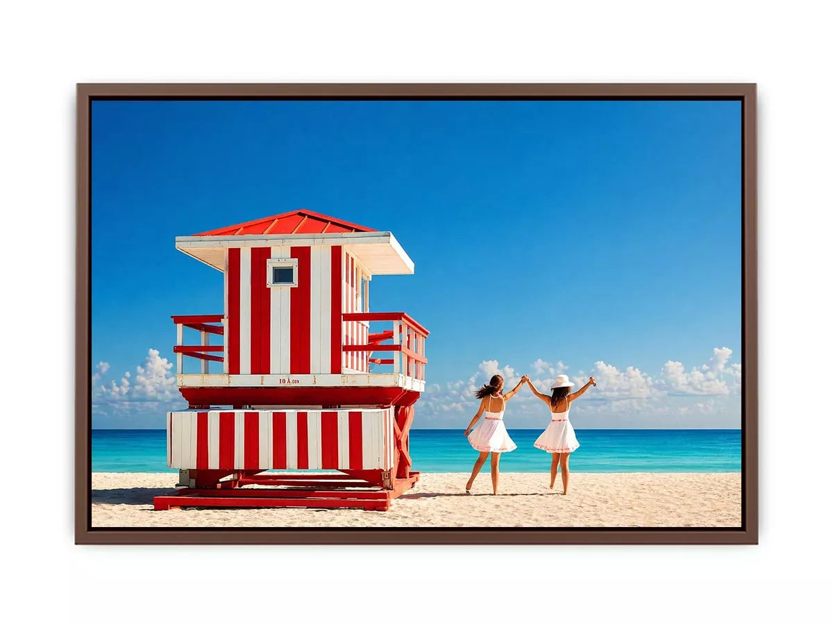 Minimal coastal beach scene with red lifeguard hut blue ocean and two women walking aesthetic Canvas Print