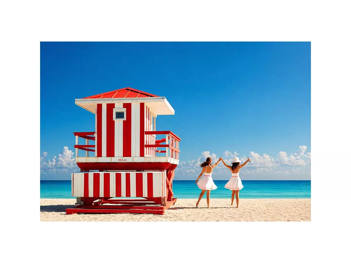 Minimal coastal beach scene with red lifeguard hut blue ocean and two women walking aesthetic Canvas Print
