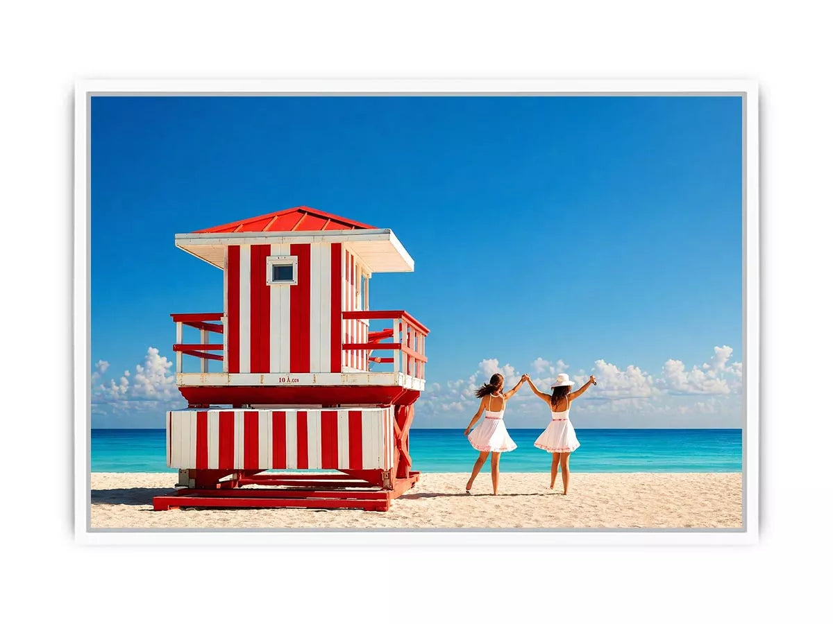 Minimal coastal beach scene with red lifeguard hut blue ocean and two women walking aesthetic Canvas Print
