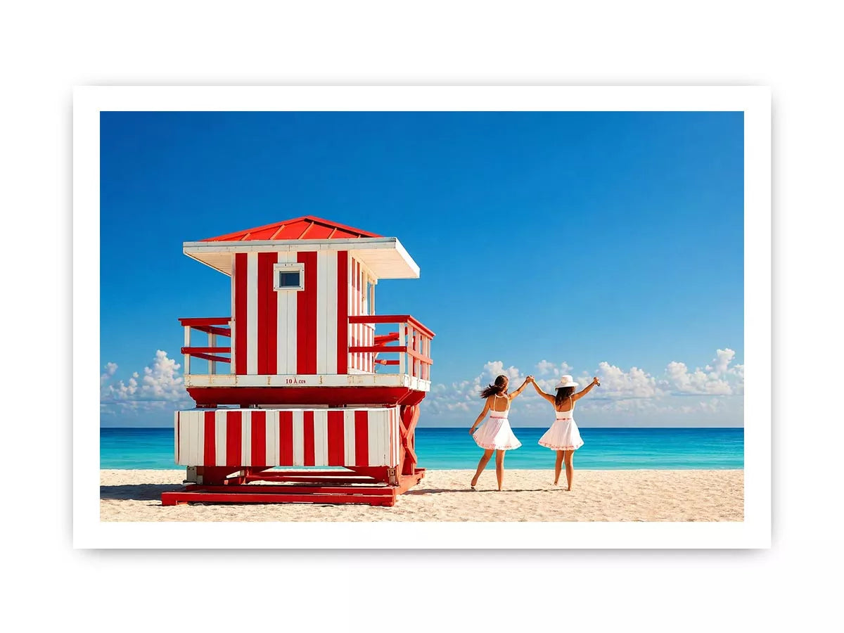 Minimal coastal beach scene with red lifeguard hut blue ocean and two women walking aesthetic Canvas Print