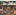 Kitchen still life canvas art with knives, tomatoes, and cookware for dining room decor.