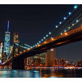 Brooklyn Bridge night canvas art with city skyline and water reflections for office decor.